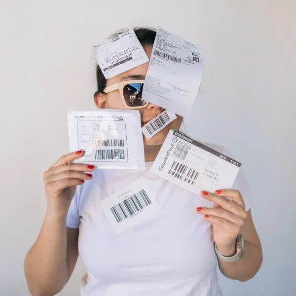 A mixture of compostable and POLLAST!C labels range stuck on a person