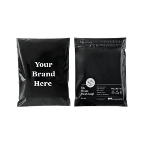 Front and back of black Better Packaging POLLAST!C mailers on a transparent background, with "Your brand here" printed on the front